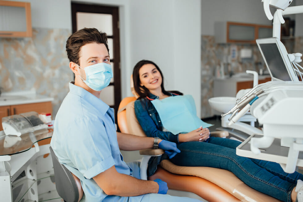 dental assistant and patient