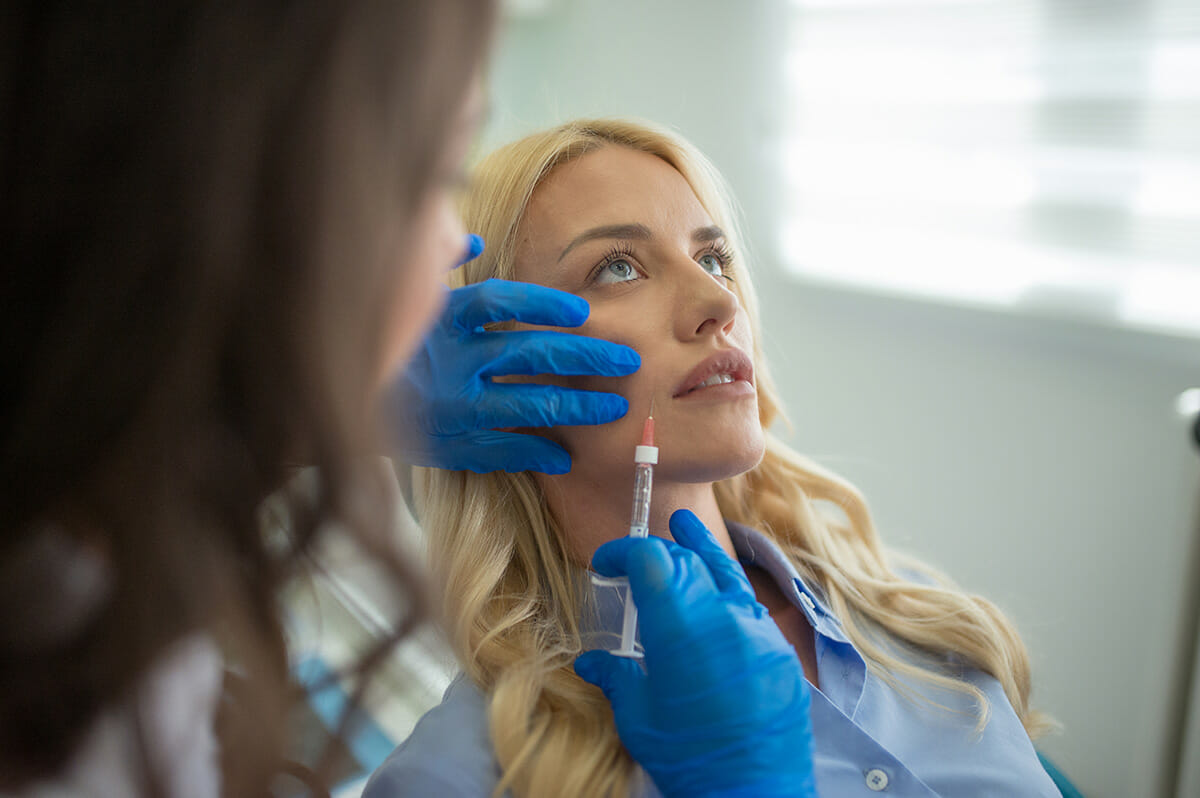 Woman getting Botox administered